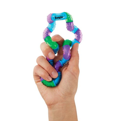 Therapy Fidget Toy - Tangle Therapy - hand holding a colorful textured sensory toy with interlocking curved segments in blue, purple, and green, shown on a plain white background.